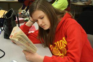 Kylie McAllister, sophomore, tediously finishes her homework before school starts Monday morning.