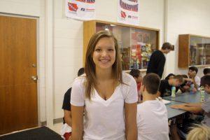 Madie Reynolds smiles in the MHS cafeteria, starting to feel at home in high school.  