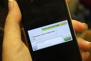 High school students text cheesy 'I love yous' back and forth during class.