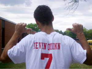 Devin Quinn, junior, fearlessly shows off his own superfan shirt.