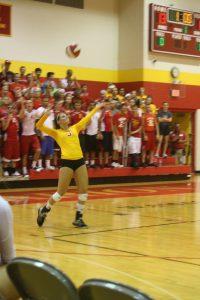 Abby Phillips serves during a past volleyball game.