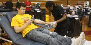 Isiah Machaca, junior, gives blood.