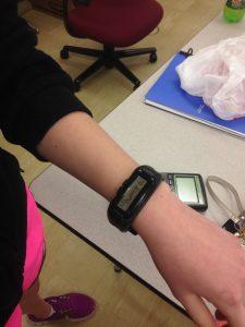 A student shows off her watch.
