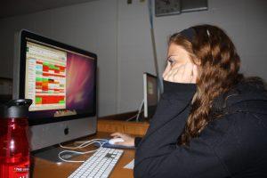 Emily Meeks, junior, checks to make sure everything is in order for One Day in May tomorrow.