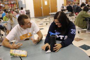 Joshua Holly and Carly Fisher, juniors, argue in the lunch room