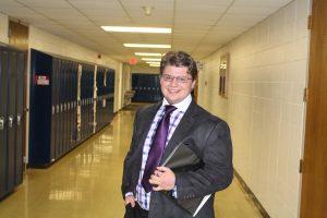 Austin Lanteri, senior, poses in the hallway for a picture