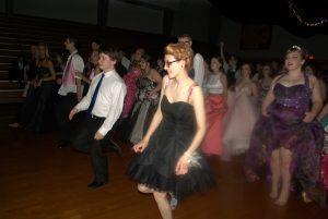 A group of students doing the Cupid Shuffle at prom 