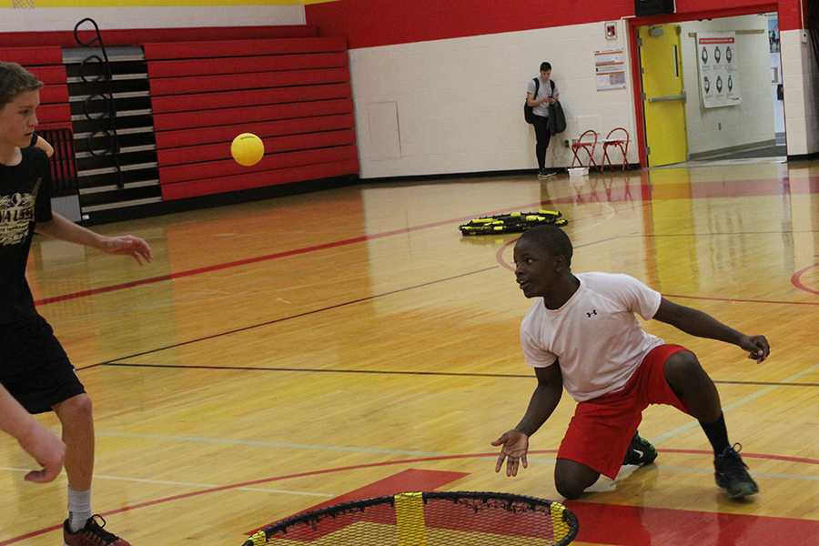 Niyo Gady, 20, gets some exercise by playing Spike Ball in his gym class.