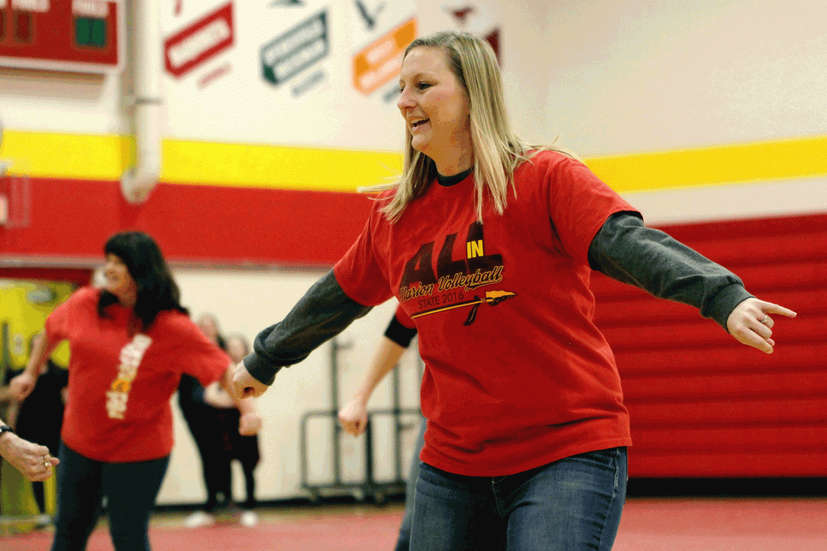 Mrs. Abby Wennekamp, along with several other MHS teachers, surprise the student body with a choreographed dance during the pep rally on 2/16.