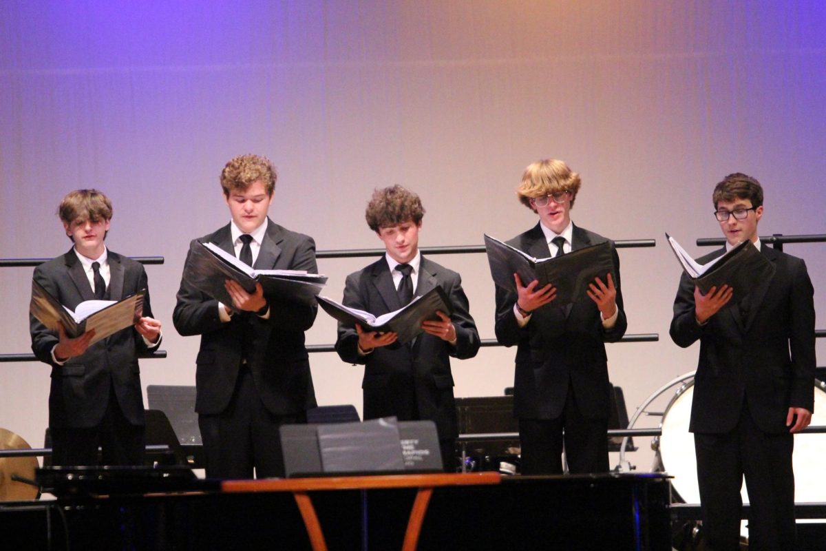 Members of the Glee Club sing in harmony during the concert at Coe College. 