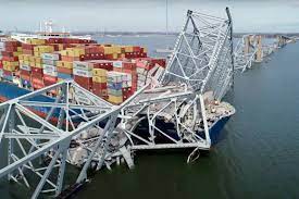 The Baltimore Bridge collapses as a cargo ship crashes into one of the main pillars.
