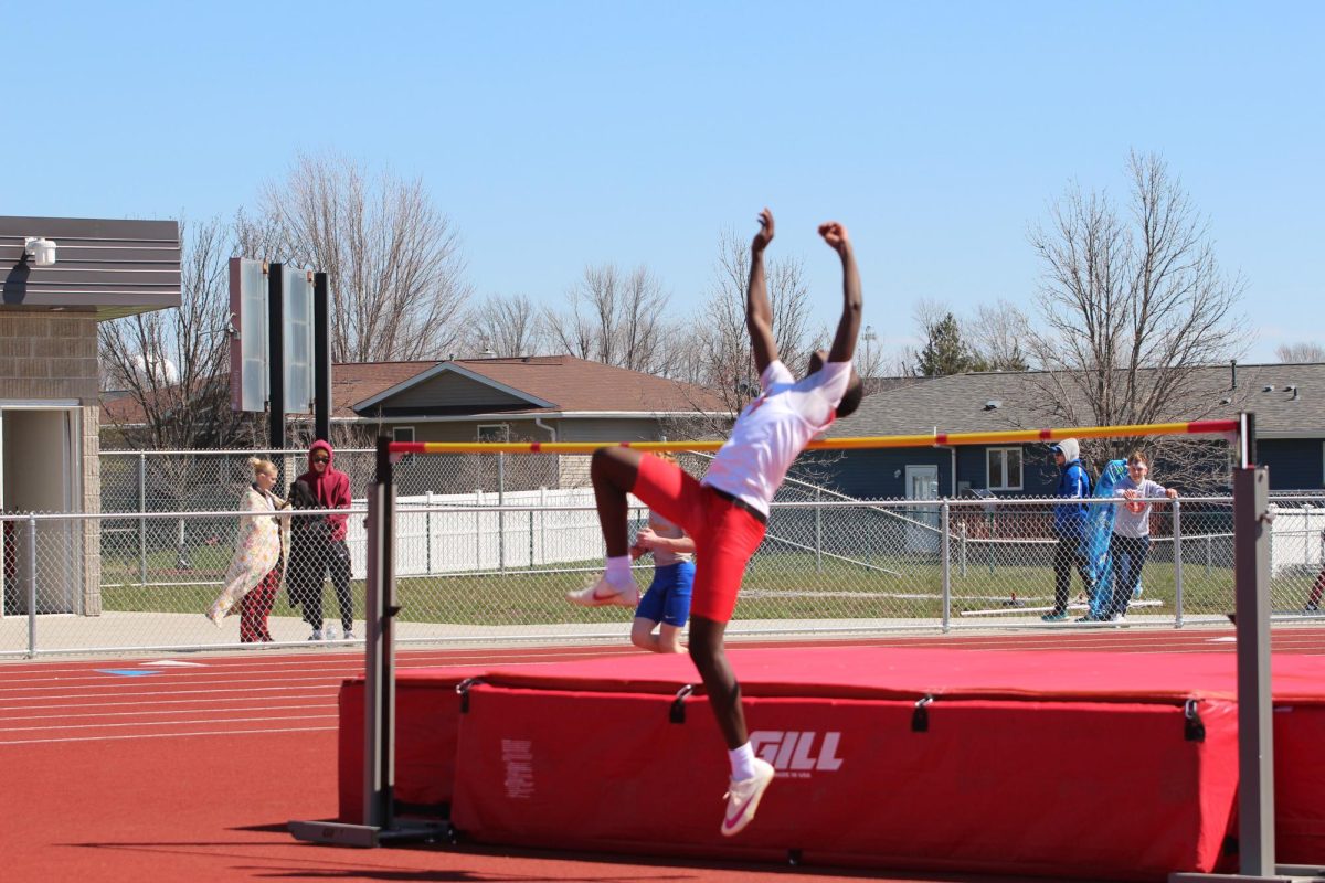 Baraka Irakoze, sophomore, puts his all into the high jump.