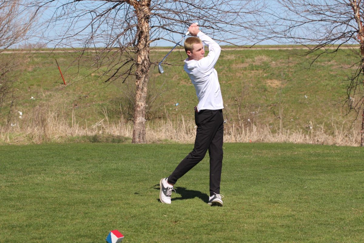 Lawson Berndt, senior, watches the trajectory of his shot. 