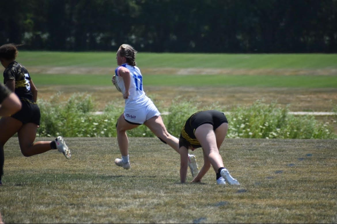 Frances Lausen, senior, makes the run with the ball to score a tri. Rugby is a newer sport to Cedar Rapids Washington High School and can be a great way to be competitive and have fun.