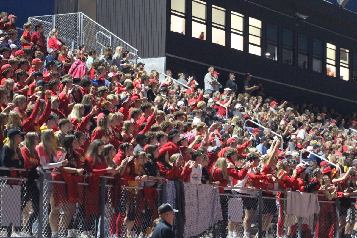 Students participate in a red out for the Homecoming game showing their school pride.
