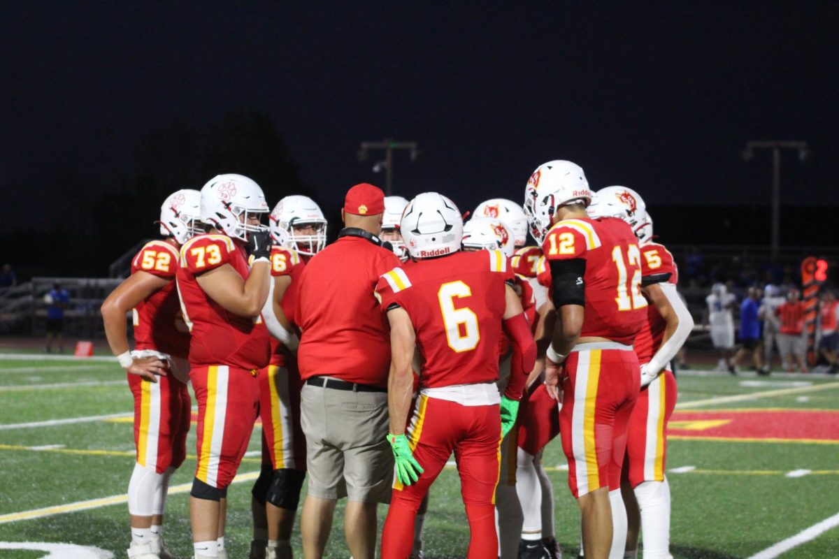 The Wolves huddle and strategize during a game against CCA. 