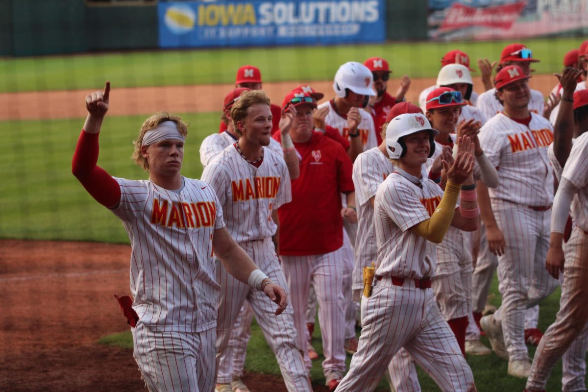 The baseball team waves to their fans after a first round win at the State tournament.