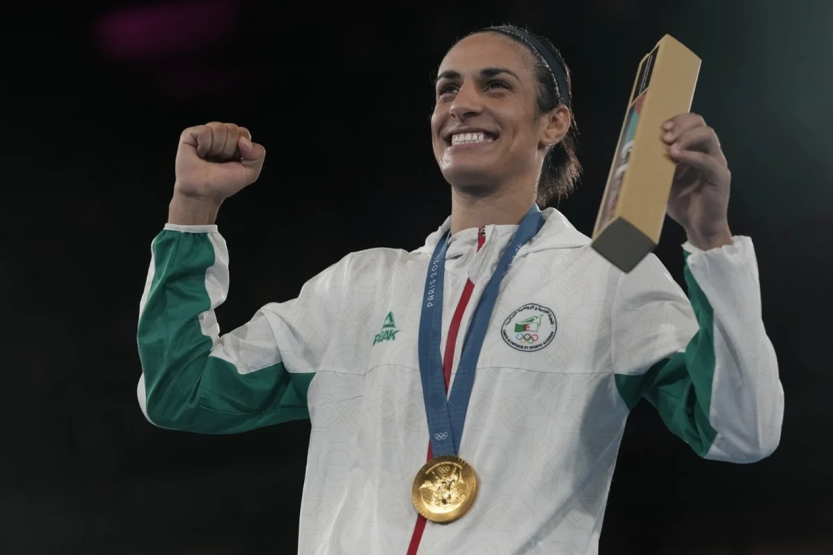 Imane Khelif celebrates her win over Yang Liu, donning her gold medal.