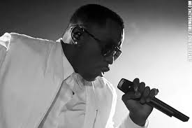 Sean “Diddy” Combs sings into the microphone while he was still famous for his better qualities.
