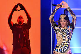 Beyonce and Jay-z hold up suspicious hand symbols similar to the Illuminati triangle. 