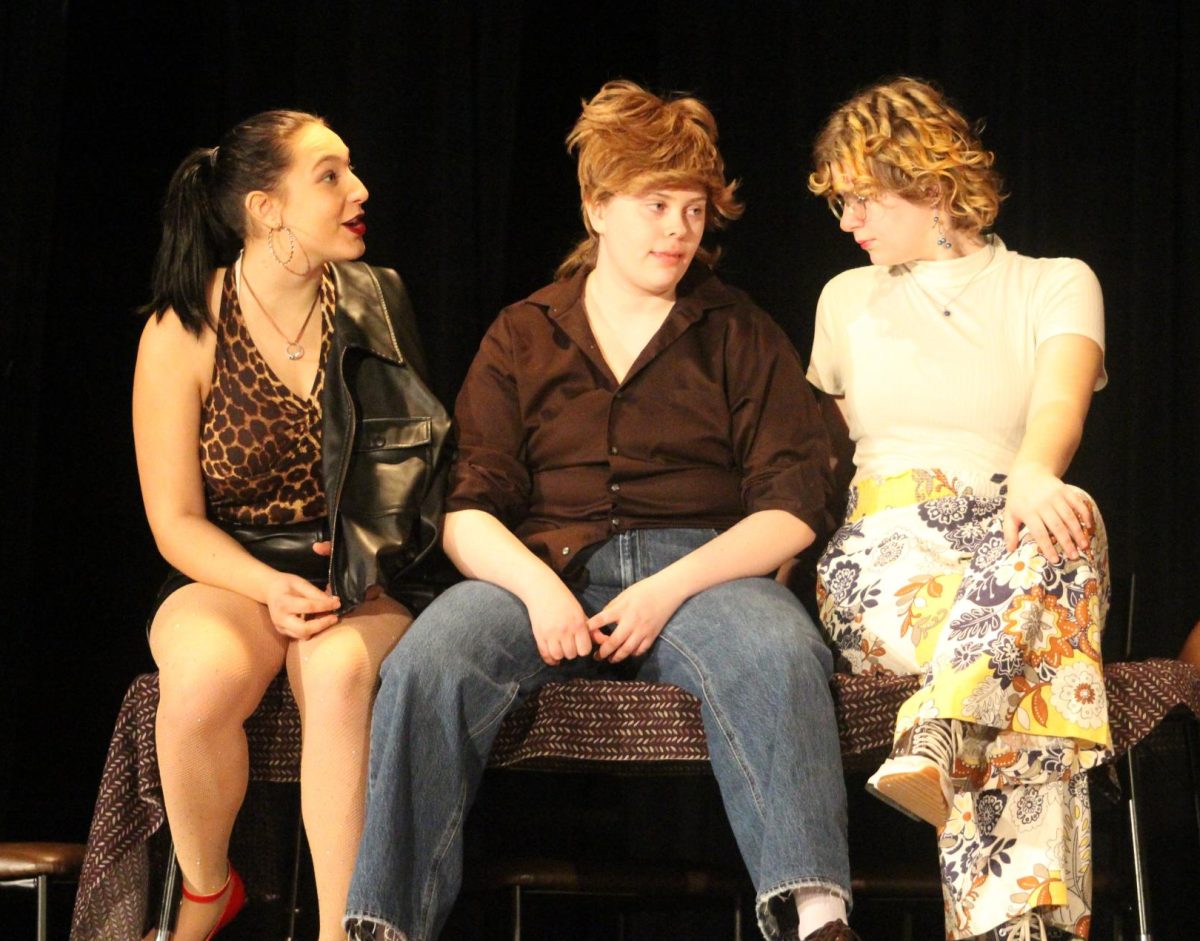 Clarissa Kerker, Grace Wittstruck, and Macie Jackson perform in the play "The Young, The Bold, The Murdered."