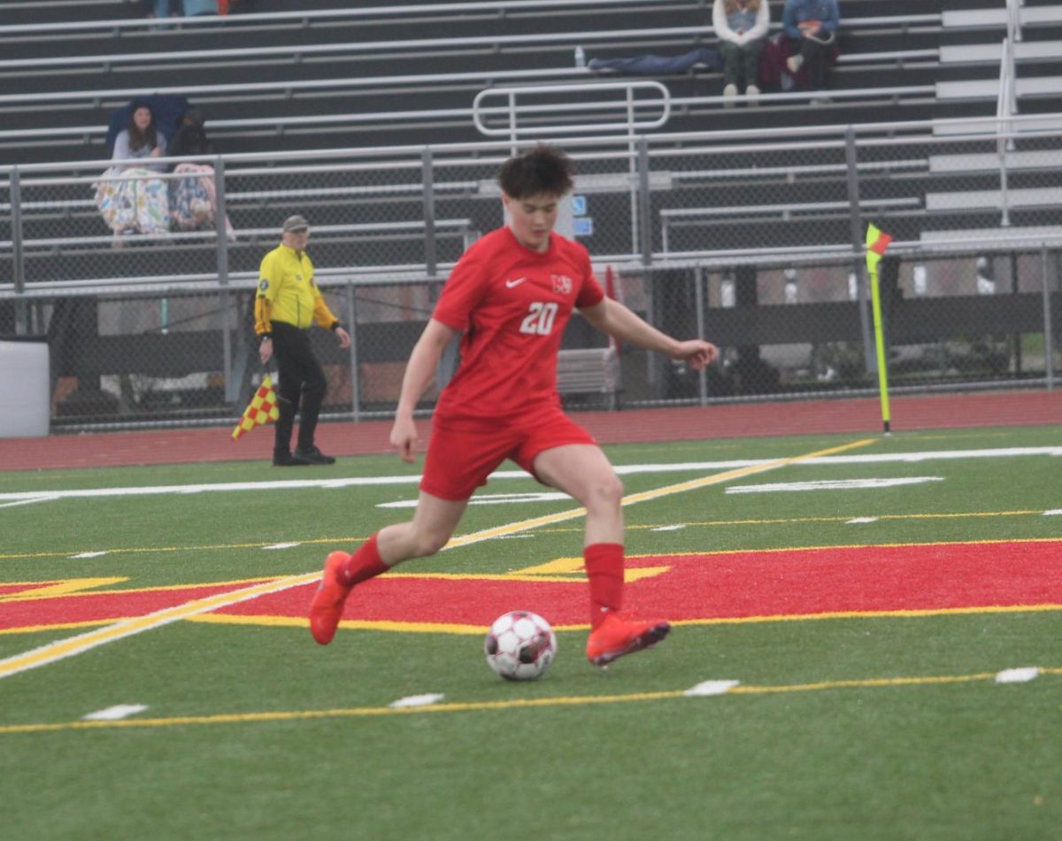 Evan Strader, '26, moves the ball downfield during a home game.
