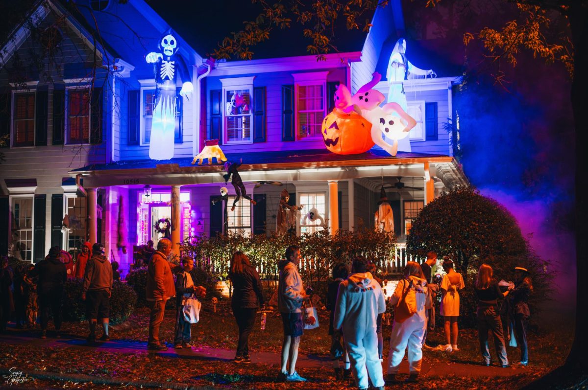 A house party is decked out in spooky Halloween decorations, similar to parties that teenagers attend instead of trick-or-treating. 