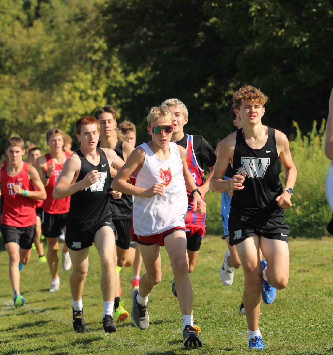 Ralph Stern, freshman, sprints to the finish line during a big XC meet.