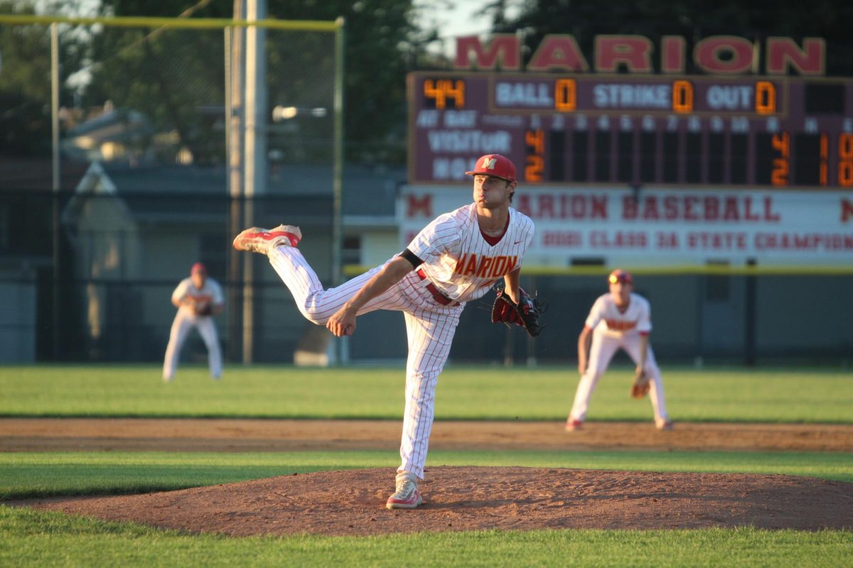 Carson Frommelt, senior, releases his pitch hoping for a strike out.