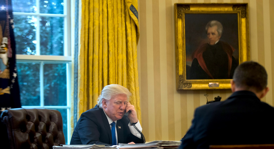 President Donald Trump does his daily duties while a portrait of Andrew Jackson is displayed behind him in the Oval Office. (Courtesy of Politico/Getty Images)