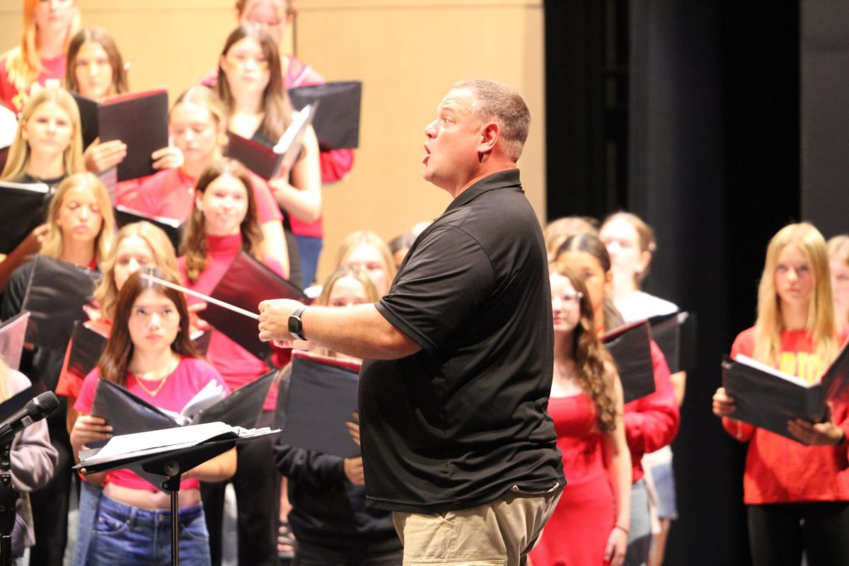 Jonathan Dyrland conducts music for the choir’s annual fall concert, which included multiple songs from the All-State Festival. 