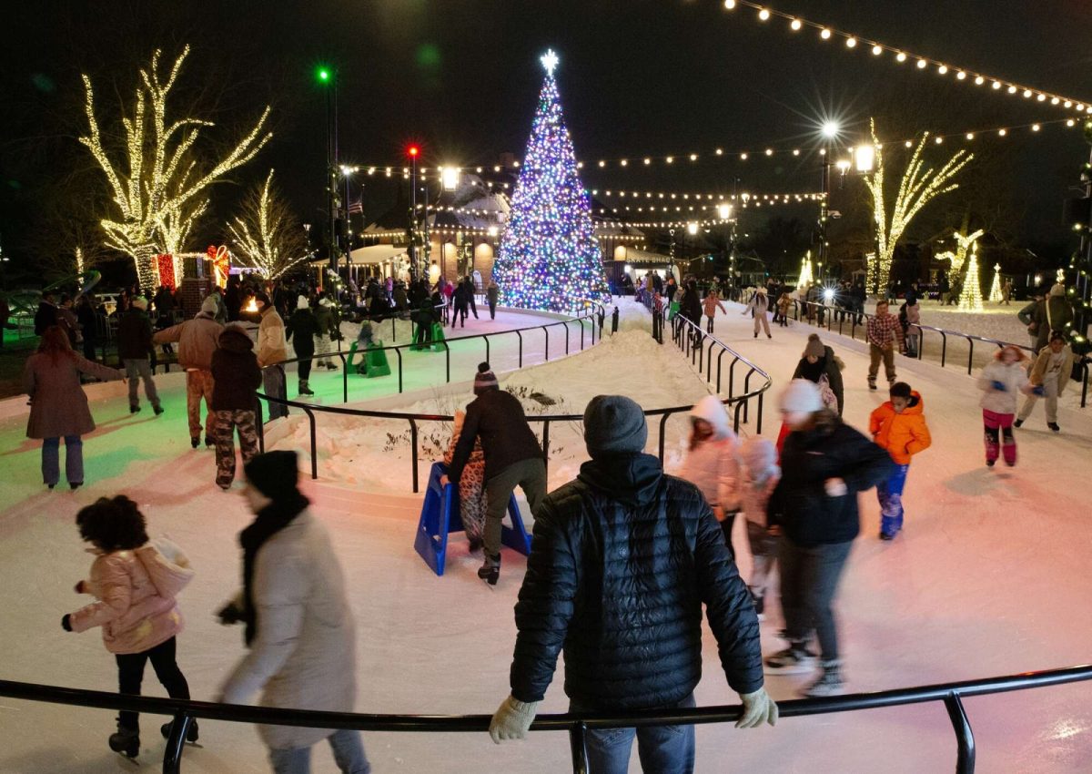 Families gather together to enjoy skating around Marion's new Ice Loop during Christmas in the Park. (Courtesy of Elizabeth Woods/Gazette)