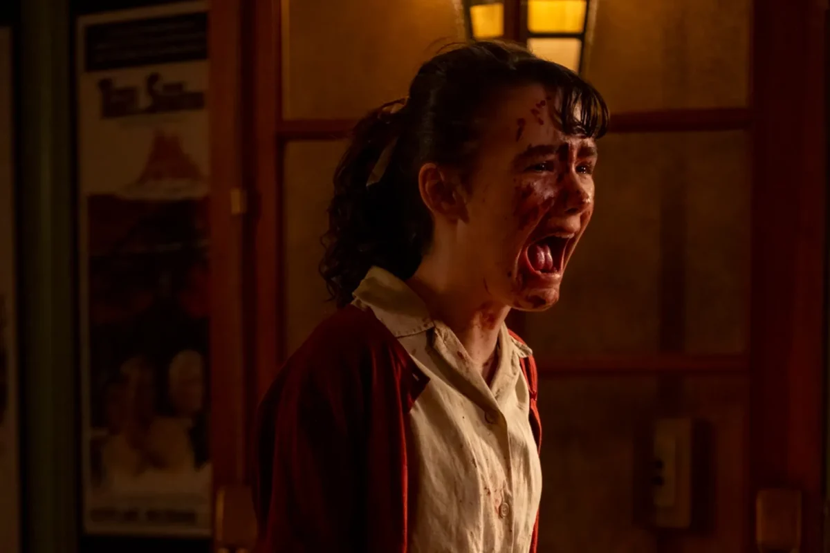 Stack as Lilly Bainbridge screams in agony during the first episode of It: Welcome to Derry, 2025.
(Courtesy of Brooke Palmer/HBO)