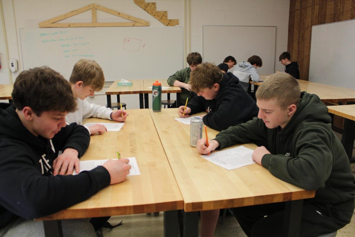 A group of sophomores strive to learn construction using paper and pencil instead of computers. (Courtesy of Gracie Uhl)