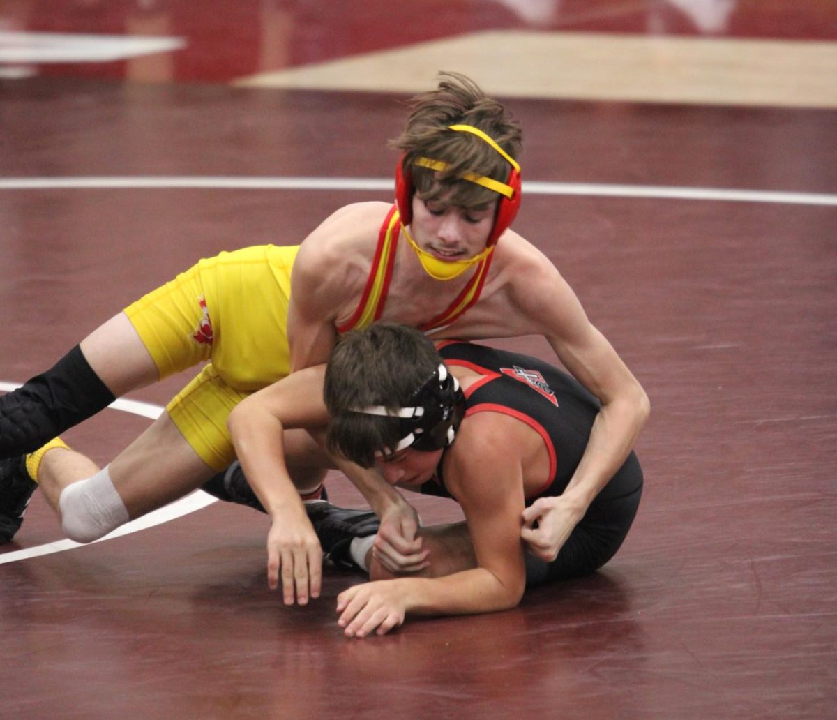 Dallas Bayler, '26, takes control of his match at a meet at Mount Vernon.