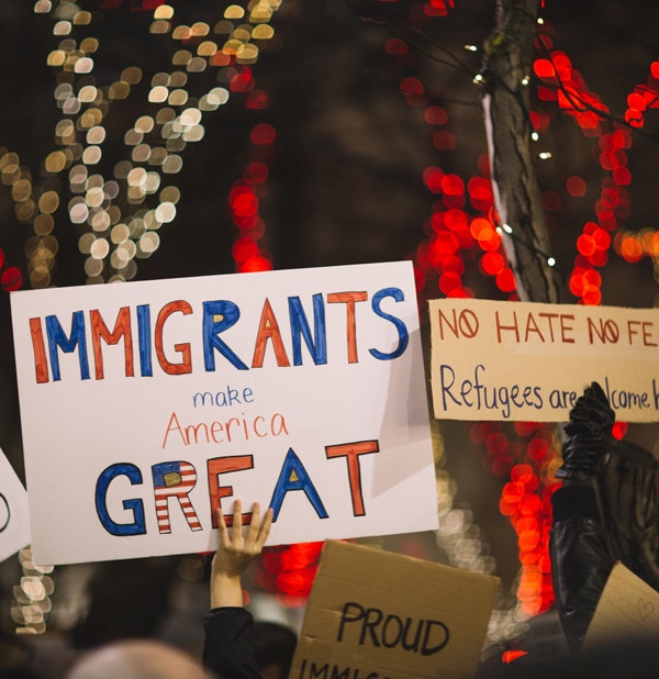 Activists express their support for immigrants and refugees. America became a country because of immigrants and their labor, and because they fuel economic growth. (Courtesy of Nitish Meena)