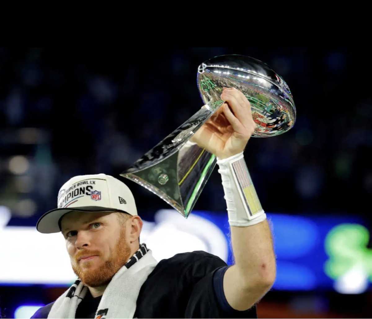 Sam Darnold holds up the Lombardi trophy after winning the Super Bowl. (Courtesy of AMNY)
