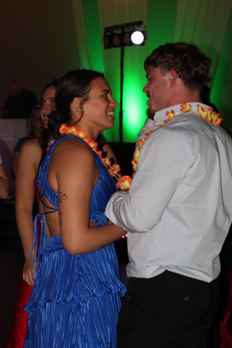 Ellie Cox, '26, and her date dance the night away at the Rio themed Prom.