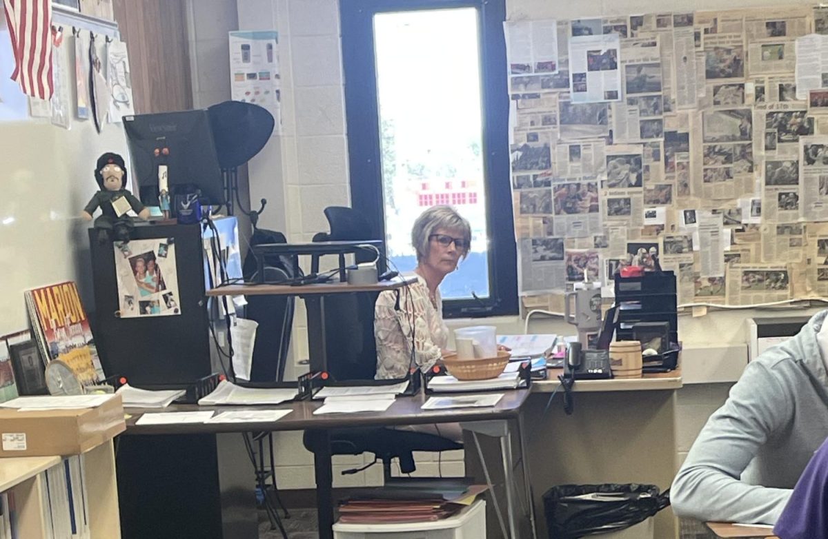 Mrs. Quinn diligently observes Mr. Mitchell's 3rd block class as they work quietly on their task.