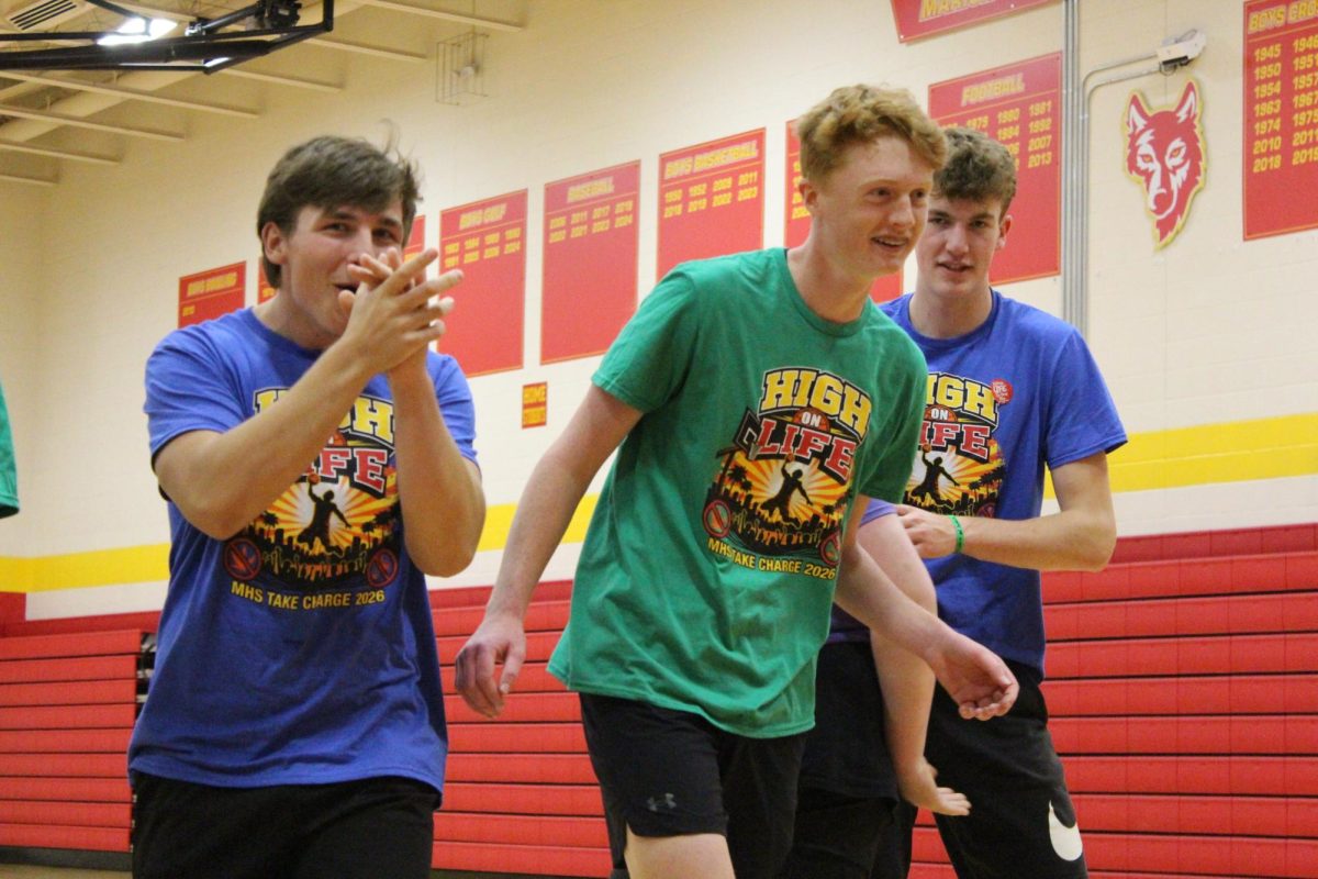 Jackson Rinderknecht, '26, Grady Oleson, '27, and Brooks Coates, '27, take part in the Green Bandana 3 v. 3 tournament.