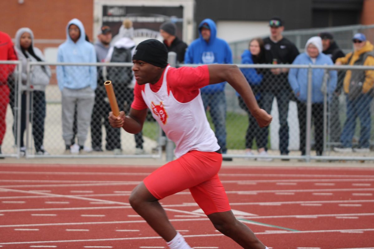 Ereel Makitu, '29, gives his all during a relay race.
