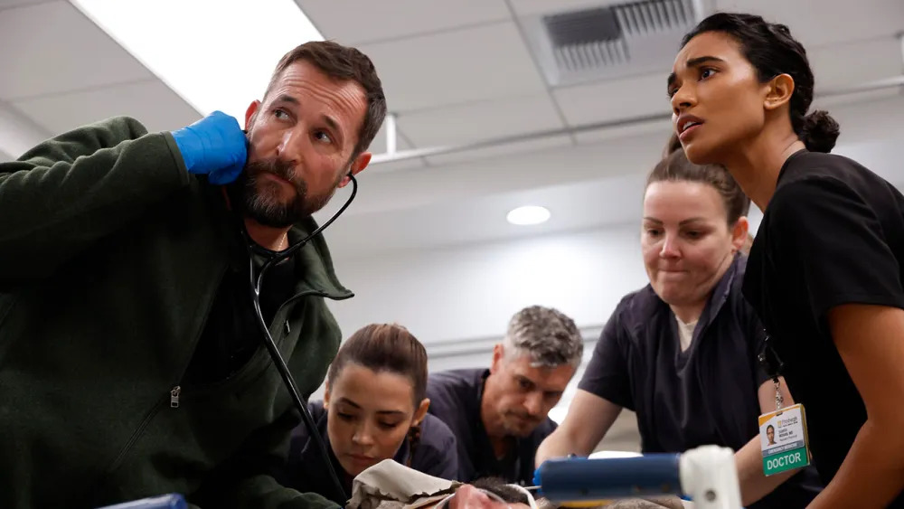 Noah Wyle’s Dr. Michael Robinavitch and Supriya Ganesh’s Dr. Samira Mohan treat a high-priority patient on the Fourth of July. (Courtesy of Warrick Page/Max)
